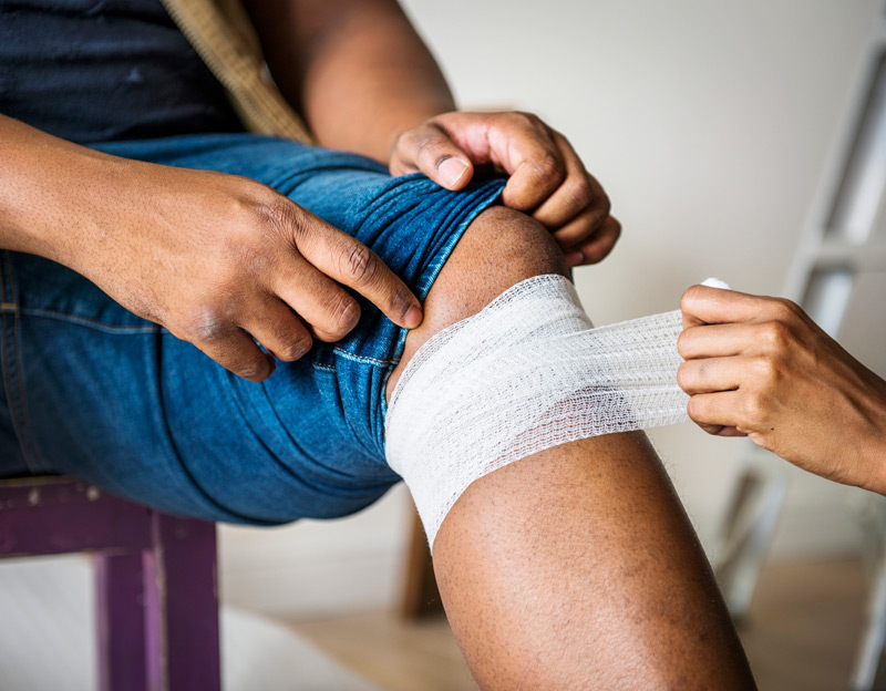 Patient-receiving-knee-wound-care-and-treatment